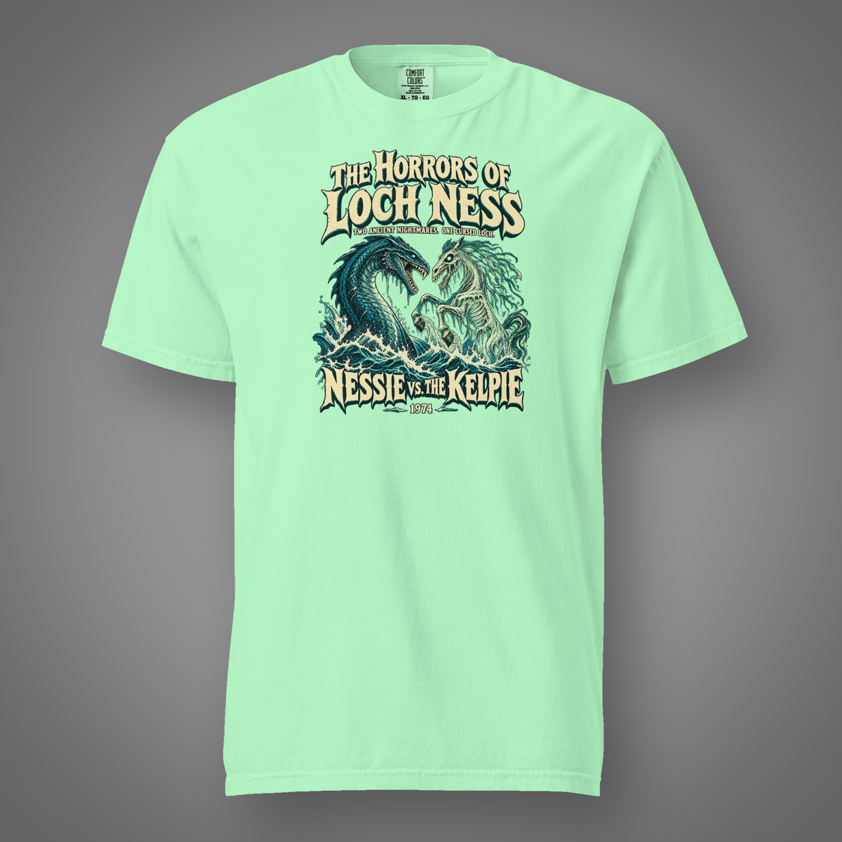 Nessie vs. The Kelpie front graphic on island reef heavyweight T-shirt — Candidate H gray studio
