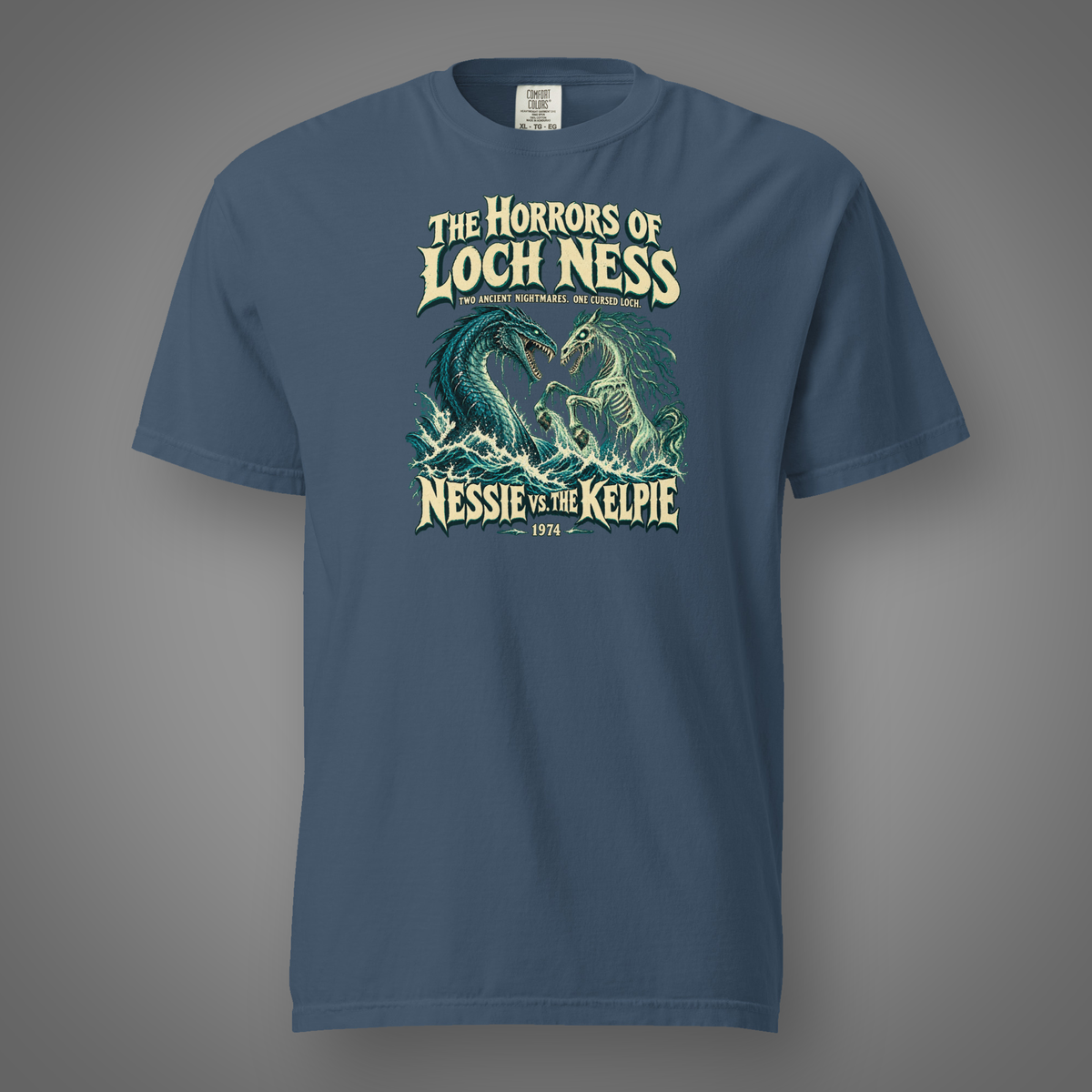 Nessie vs. The Kelpie front graphic on midnight heavyweight T-shirt — Candidate H gray studio