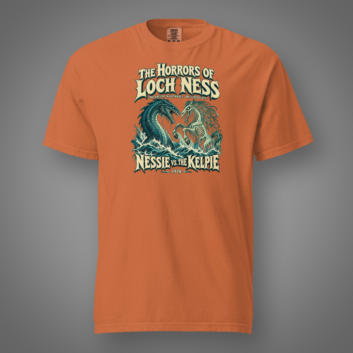 Nessie vs. The Kelpie front graphic on yam heavyweight T-shirt — Candidate H gray studio